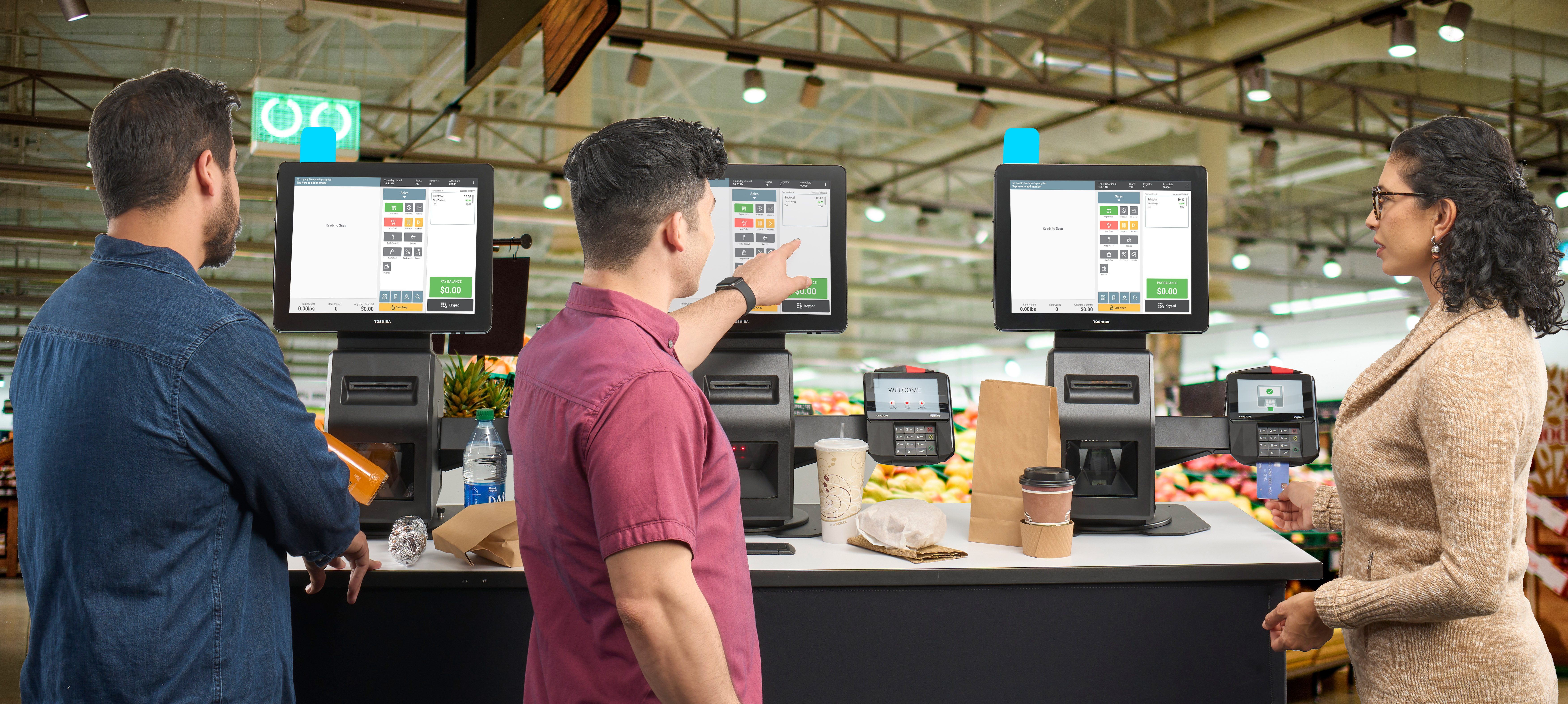 3 people using self checkout